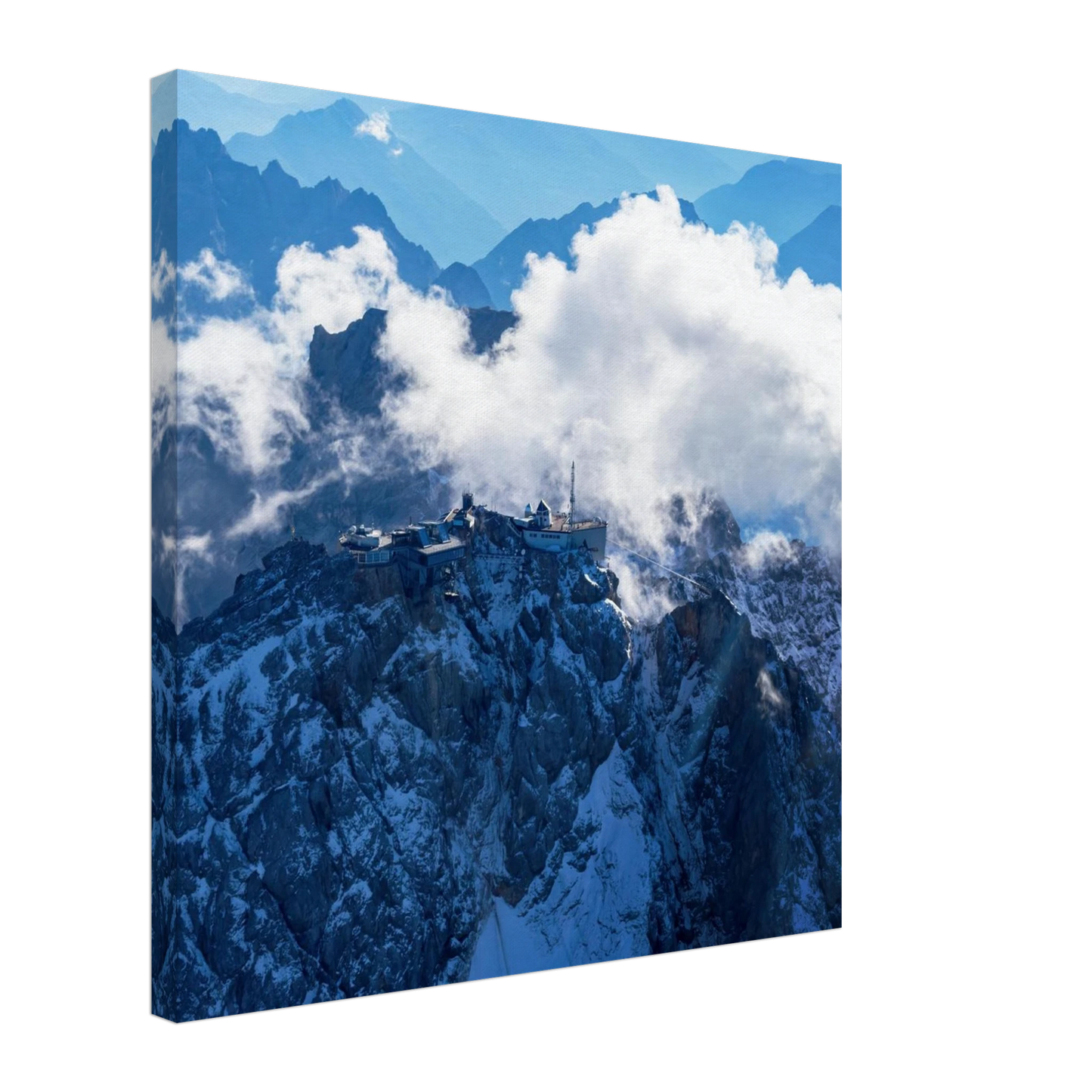 Wandbild alpine majesty gipfelstation im wolkenmeer mit blauen bergsilhouetten