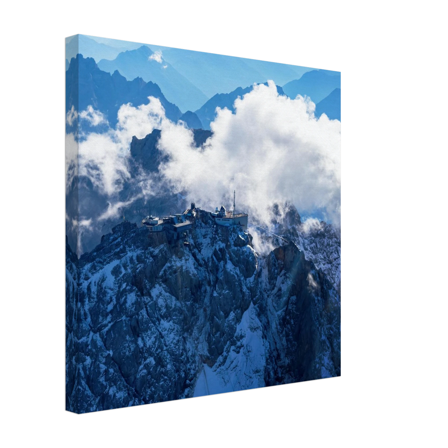 Wandbild alpine majesty gipfelstation im wolkenmeer mit blauen bergsilhouetten