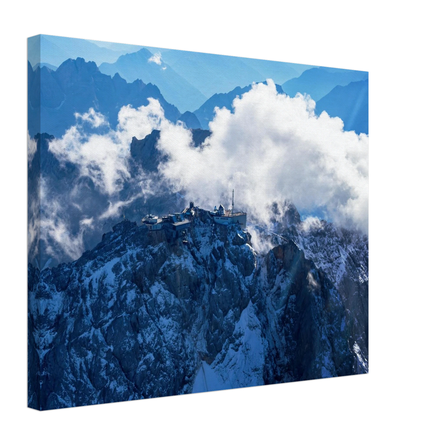 Wandbild alpine majesty gipfelstation im wolkenmeer mit blauen bergsilhouetten