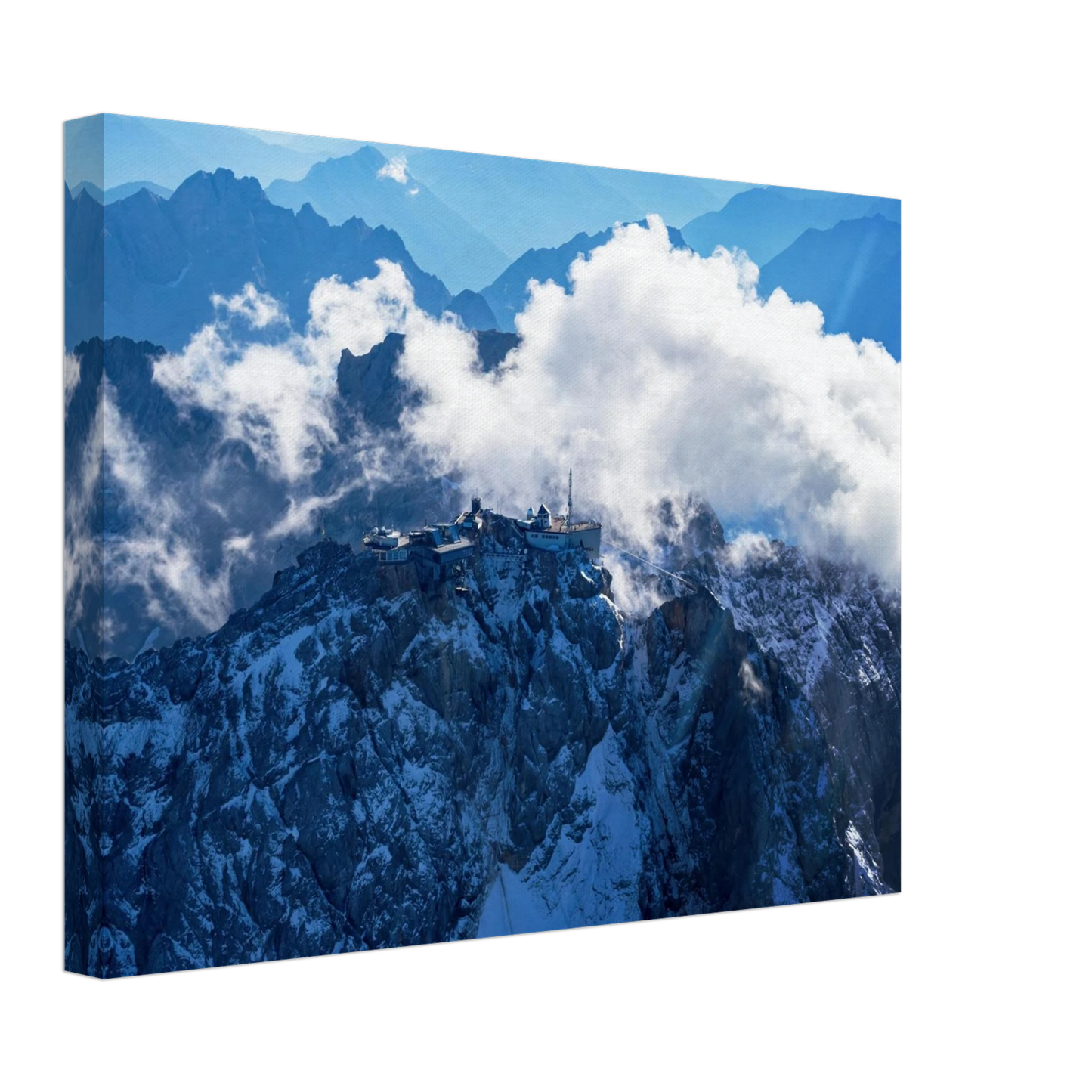 Wandbild alpine majesty gipfelstation im wolkenmeer mit blauen bergsilhouetten